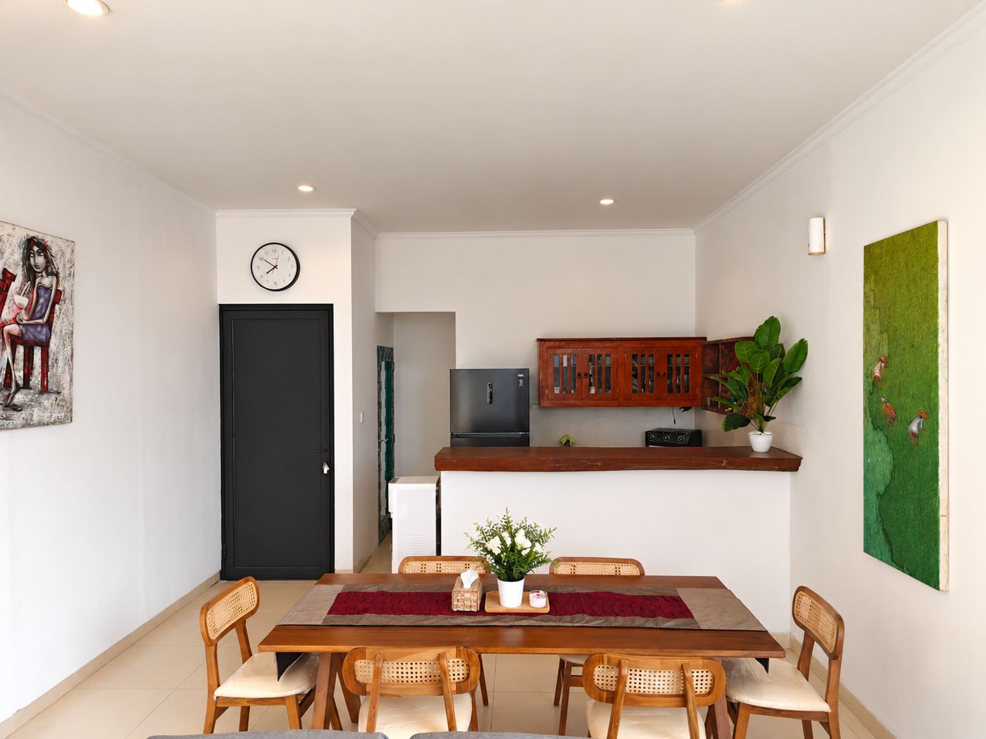 Dining table for six with open kitchen behind